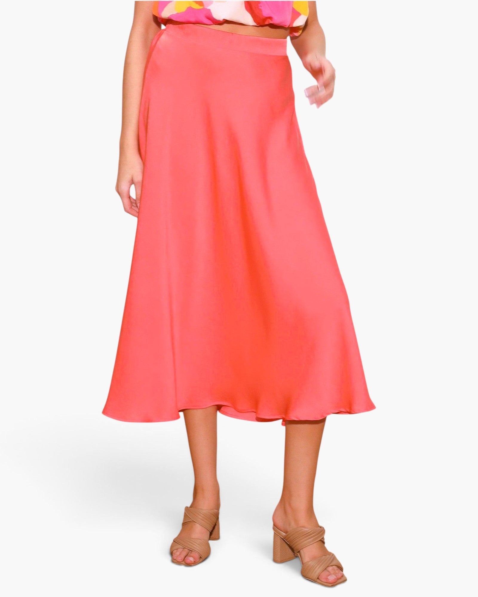 Beach Rose Co. coral midi swing skirt in washed poly silk with a fluid drape and elegant sheen on a model