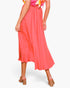 Beach Rose Co. coral pink washed poly silk midi swing skirt with pleated detail worn with tan block heel sandals