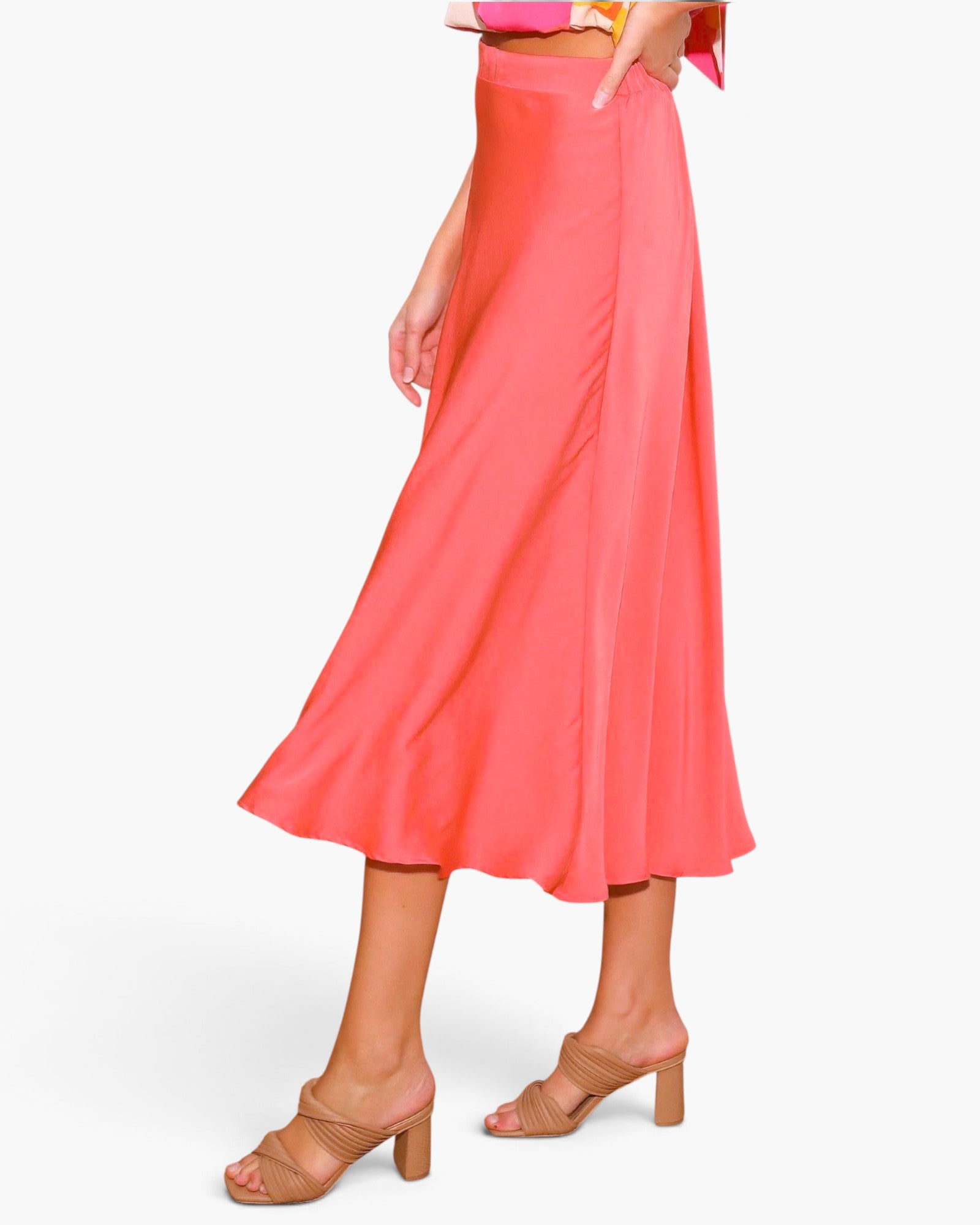 Beach Rose Co. coral midi swing skirt in washed poly silk with a fluid drape and elegant sheen on a model