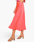 Beach Rose Co. coral midi swing skirt in washed poly silk with a fluid drape and elegant sheen on a model