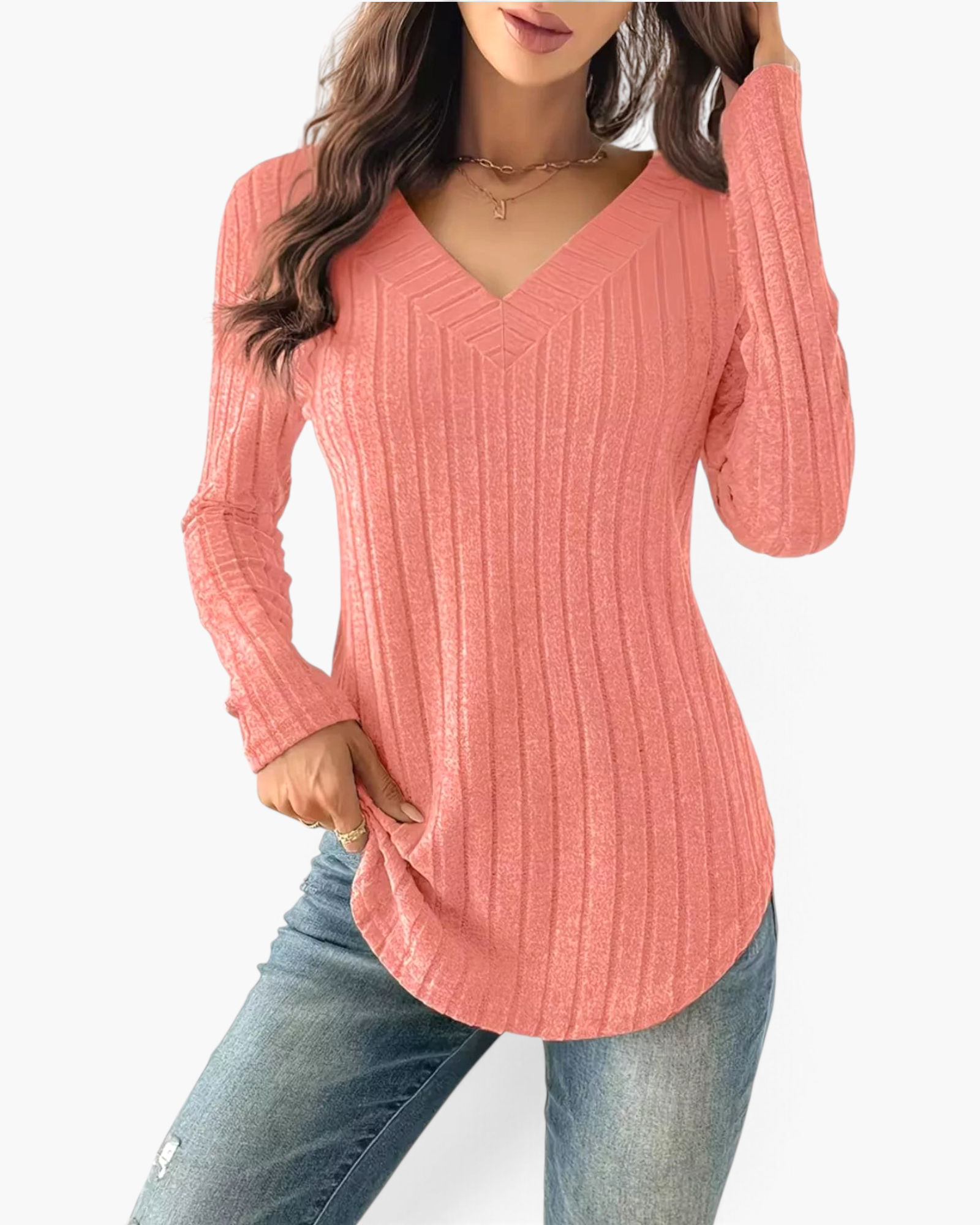 Beach Rose Co. coral pink long sleeve top in a vertical ribbed knit with a wide V-neckline and curved hem.