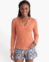 Beach Rose Co. coral ribbed long sleeve V-neck top with contrast stitching and decorative neckline detail.