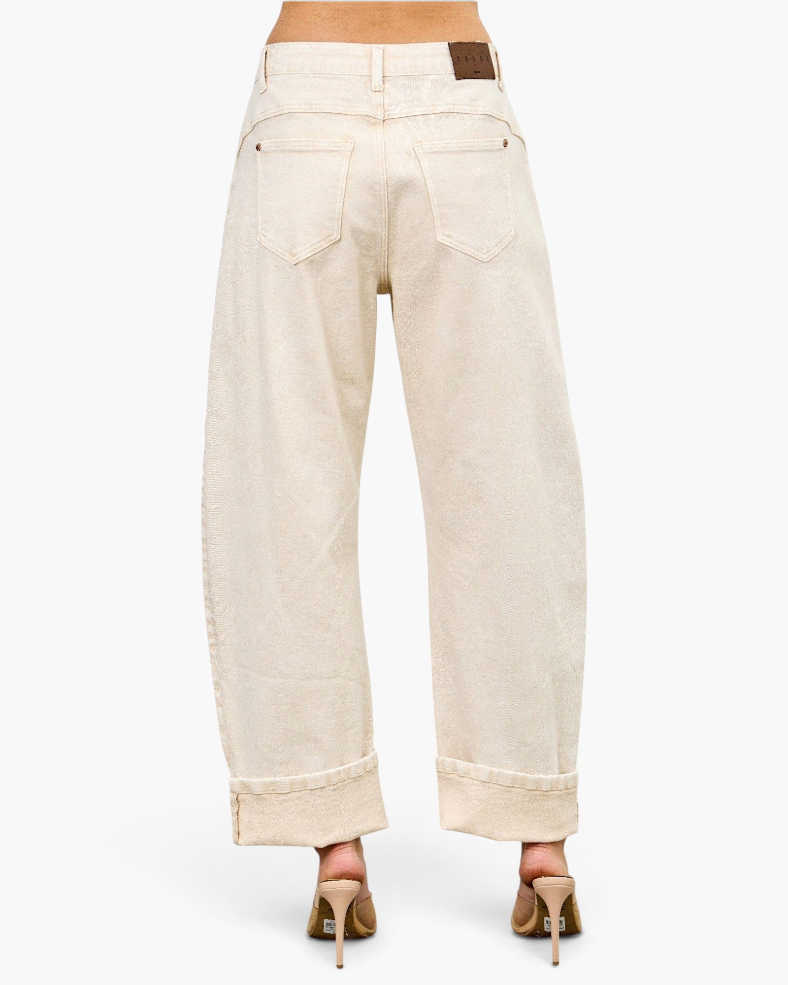 Beach Rose Co. high-rise barrel-leg jeans in cream stretch denim with a back view and cuffed hems.