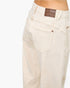 Beach Rose Co. high-rise cream barrel jeans with a brown leather back patch and classic five-pocket styling.