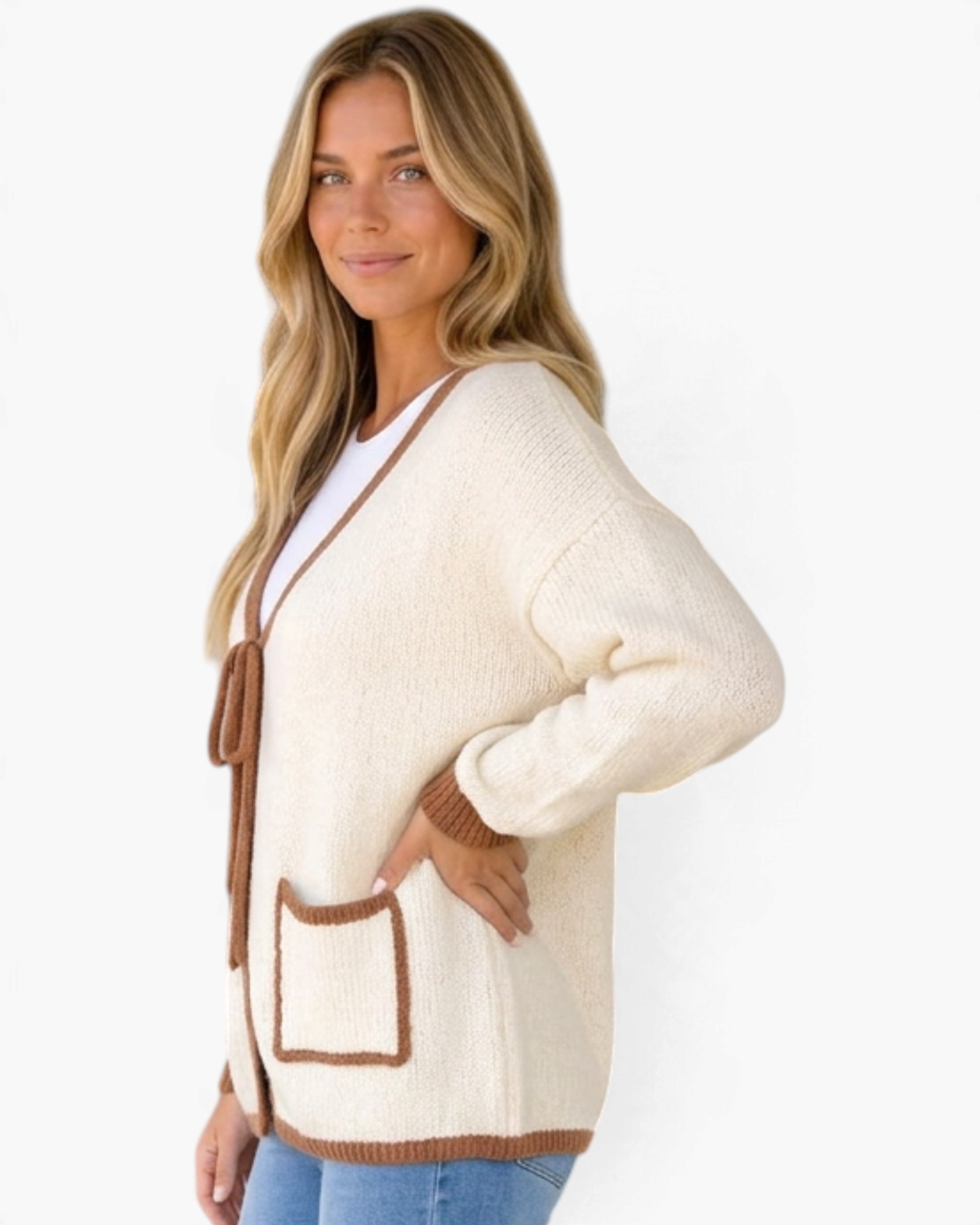 Beach Rose Co. cream knit cardigan with brown contrast trim, tie-front closure, and patch pockets on a blonde model.