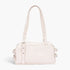 Beach Rose Co. cream faux leather sport bag with dual handles and silver metal hardware details.