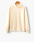 Beach Rose Co. cream long sleeve top with a high neck and relaxed shift silhouette on a wooden hanger