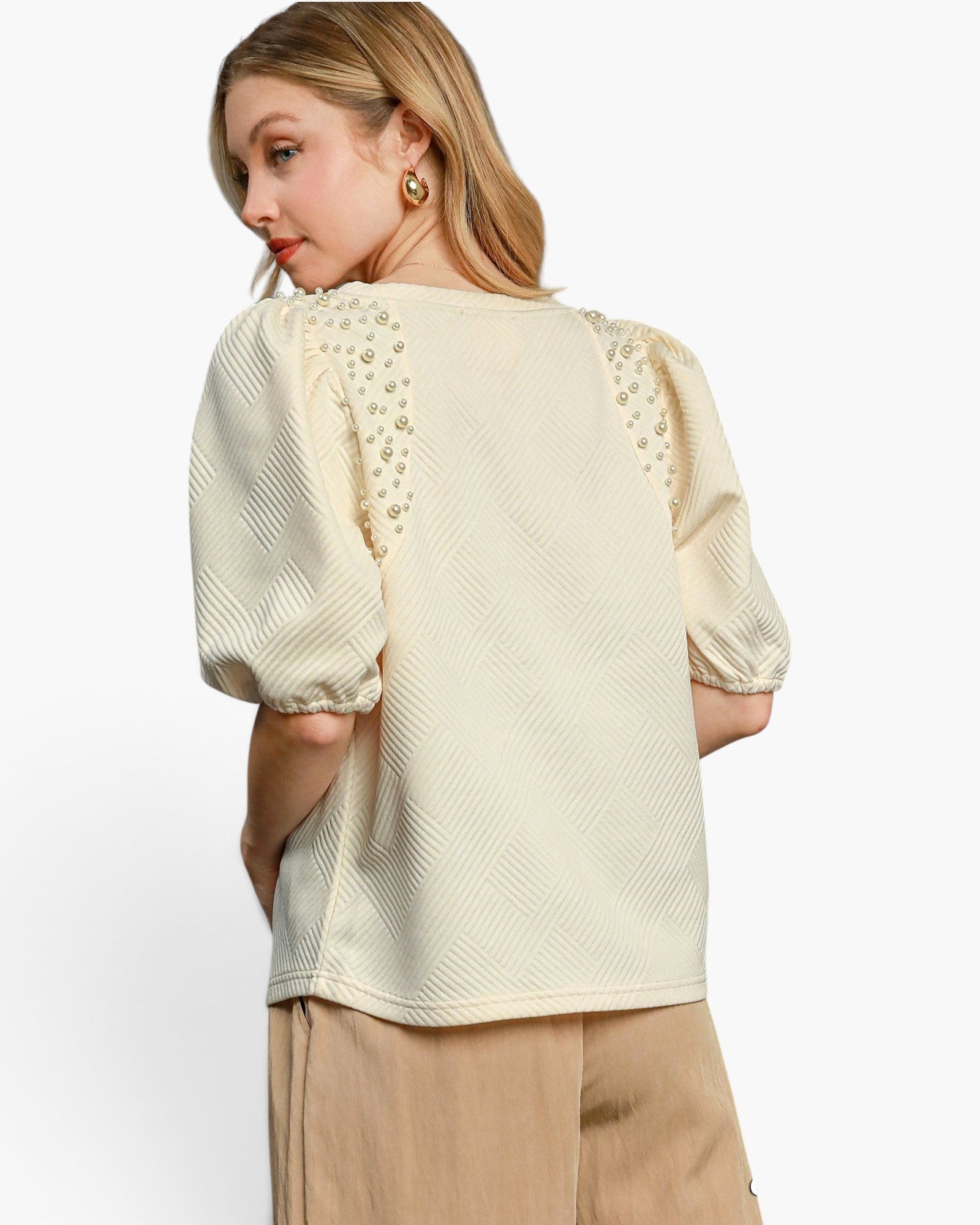 Beach Rose Co. cream knit jacquard top with puff sleeves and pearl embellishments on the shoulders