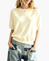 Beach Rose Co. cream polyester crewneck sweatshirt with elbow-length puff sleeves and raglan seams on a model
