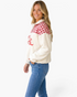 Beach Rose Co. cream sherpa half-zip pullover with red gingham panels and Merry Christmas lettering on a model