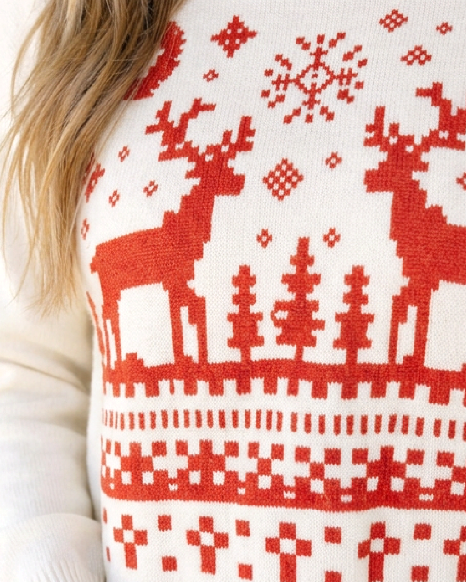 Beach Rose Co. cream crewneck sweater featuring a festive red reindeer, snowflake, and geometric knit pattern.