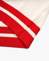 Beach Rose Co. cream sweater featuring red and white striped ribbed cuffs and hem detail