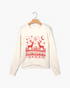 Beach Rose Co. cream crewneck sweater featuring a red reindeer, snowflake, and geometric knit pattern.