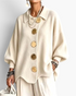 Beach Rose Co. cream ribbed knit cardigan with a collared neckline, balloon sleeves, and large gold button details.
