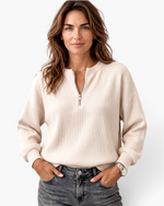 Beach Rose Co. model wearing a cream ribbed quarter-zip pullover with dropped shoulders and banded cuffs.