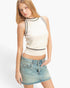 Beach Rose Co. sleeveless ribbed knit top in cream with black contrast trim worn by a model with a denim skirt