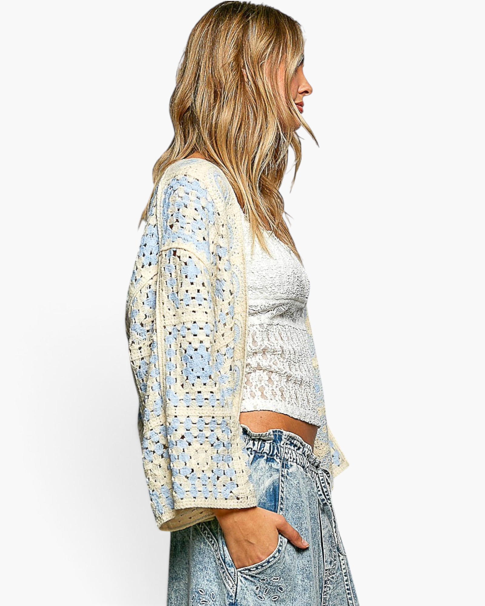Beach Rose Co. ivory and light blue patchwork crochet open-front cardigan with three-quarter sleeves on a model.
