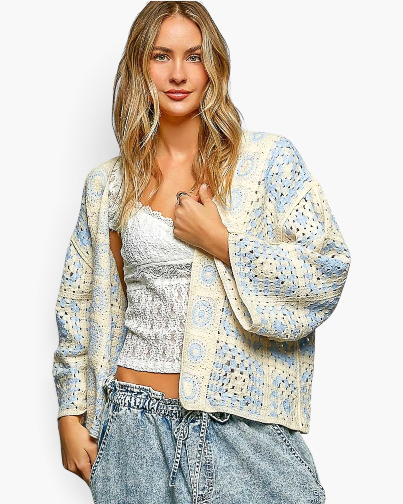 Beach Rose Co. ivory and light blue patchwork crochet open-front cardigan with three-quarter sleeves on a model