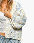 Beach Rose Co. ivory and light blue patchwork crochet open-front cardigan with relaxed three-quarter sleeves.
