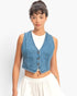 Beach Rose Co. cropped blue denim vest with a V-neck and button-front, worn over a white top by a model.