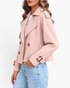 Beach Rose Co. light pink cropped double-breasted trench jacket with wide lapels and buckled cuffs on a model