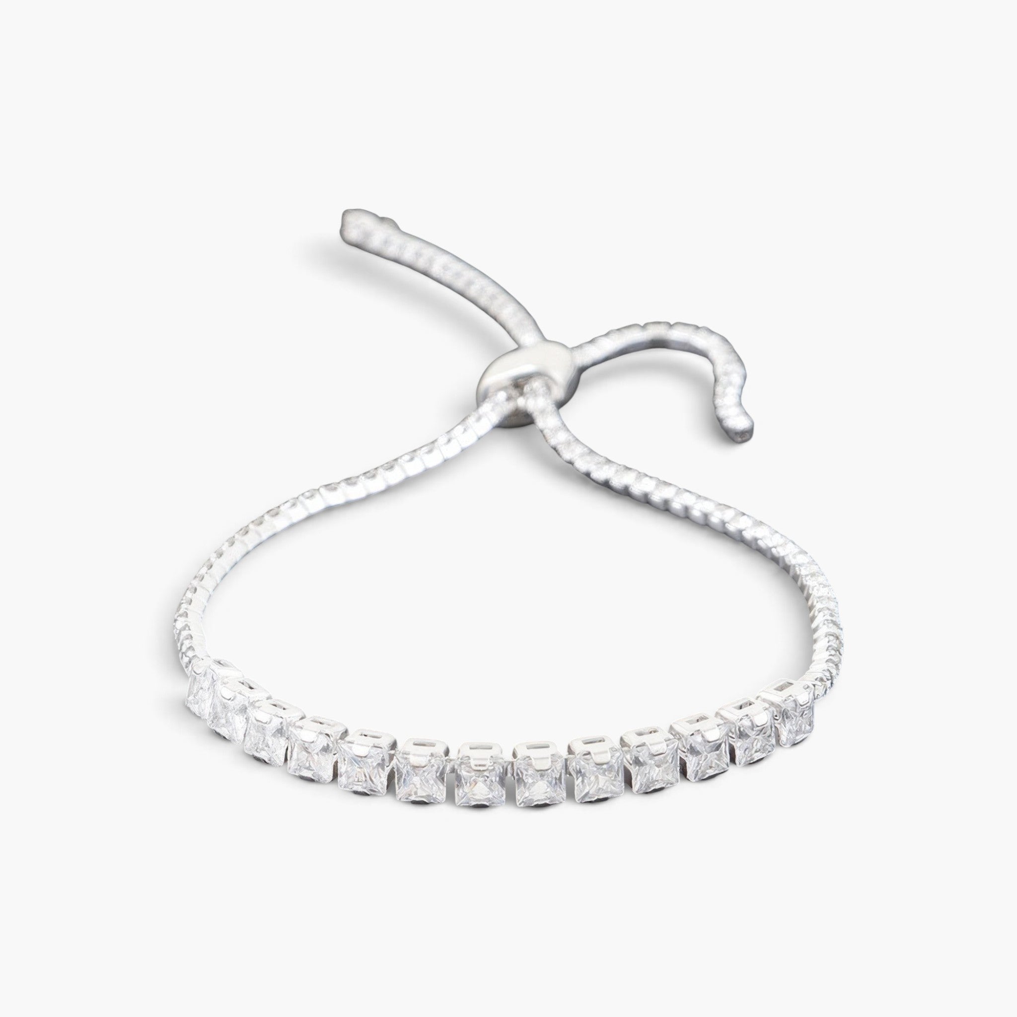 Beach Rose Co. tennis bracelet featuring a row of clear square-cut cubic gemstones and an adjustable slider closure.