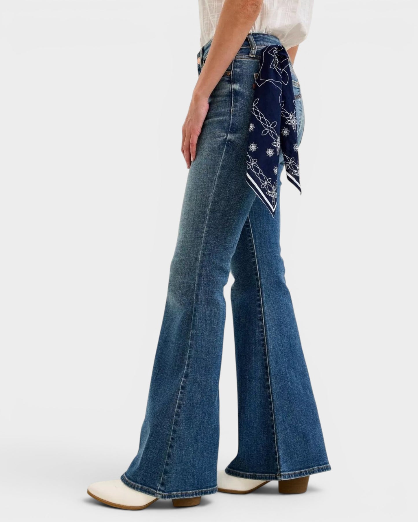 Beach Rose Co. Dark wash denim flare jeans with a blue bandana accent tied at the waist. Mid-rise, slightly stretchy cotton blend.