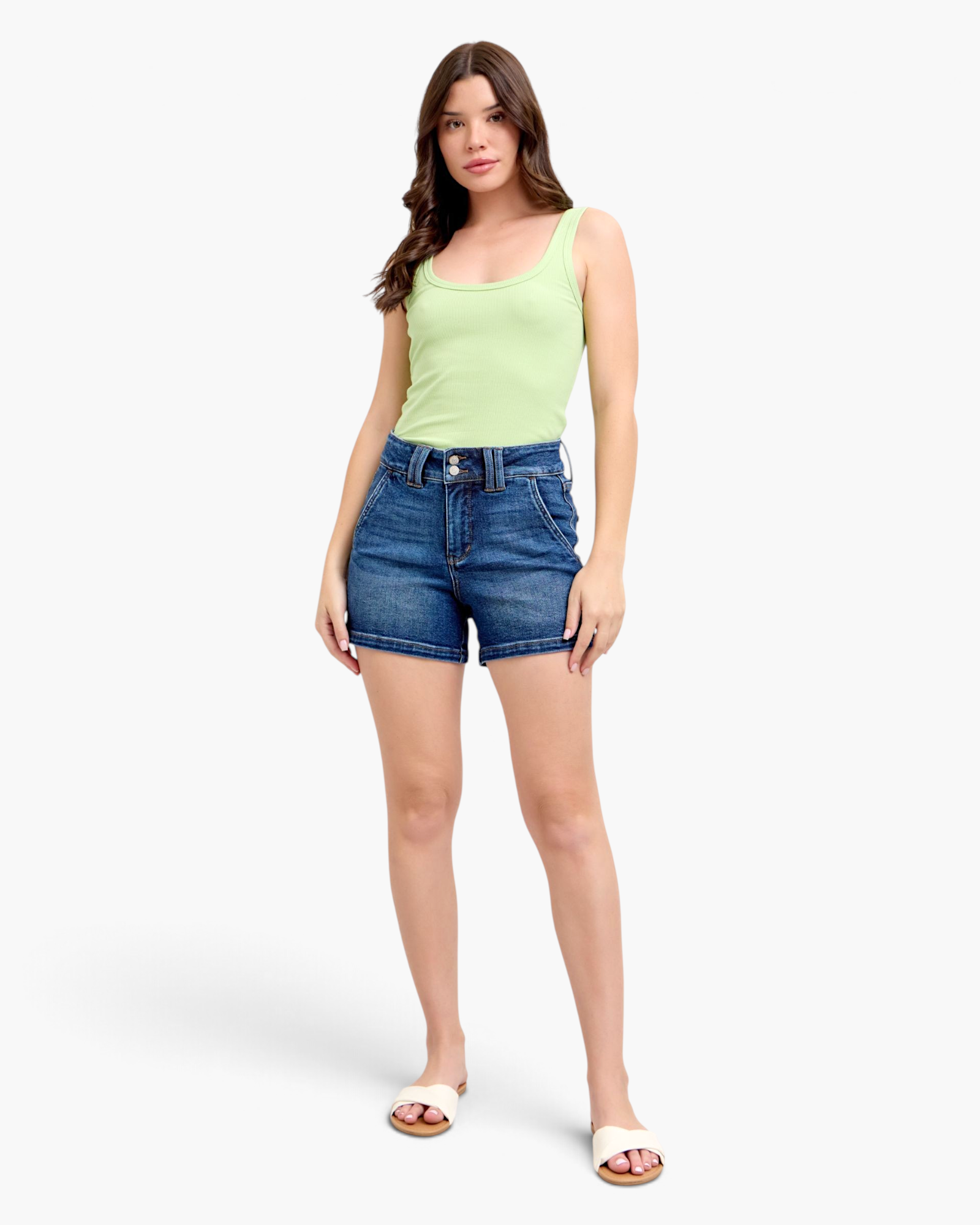 Beach Rose Co. dark wash denim shorts with a wide double-button waistband worn by a model in a light green tank top.