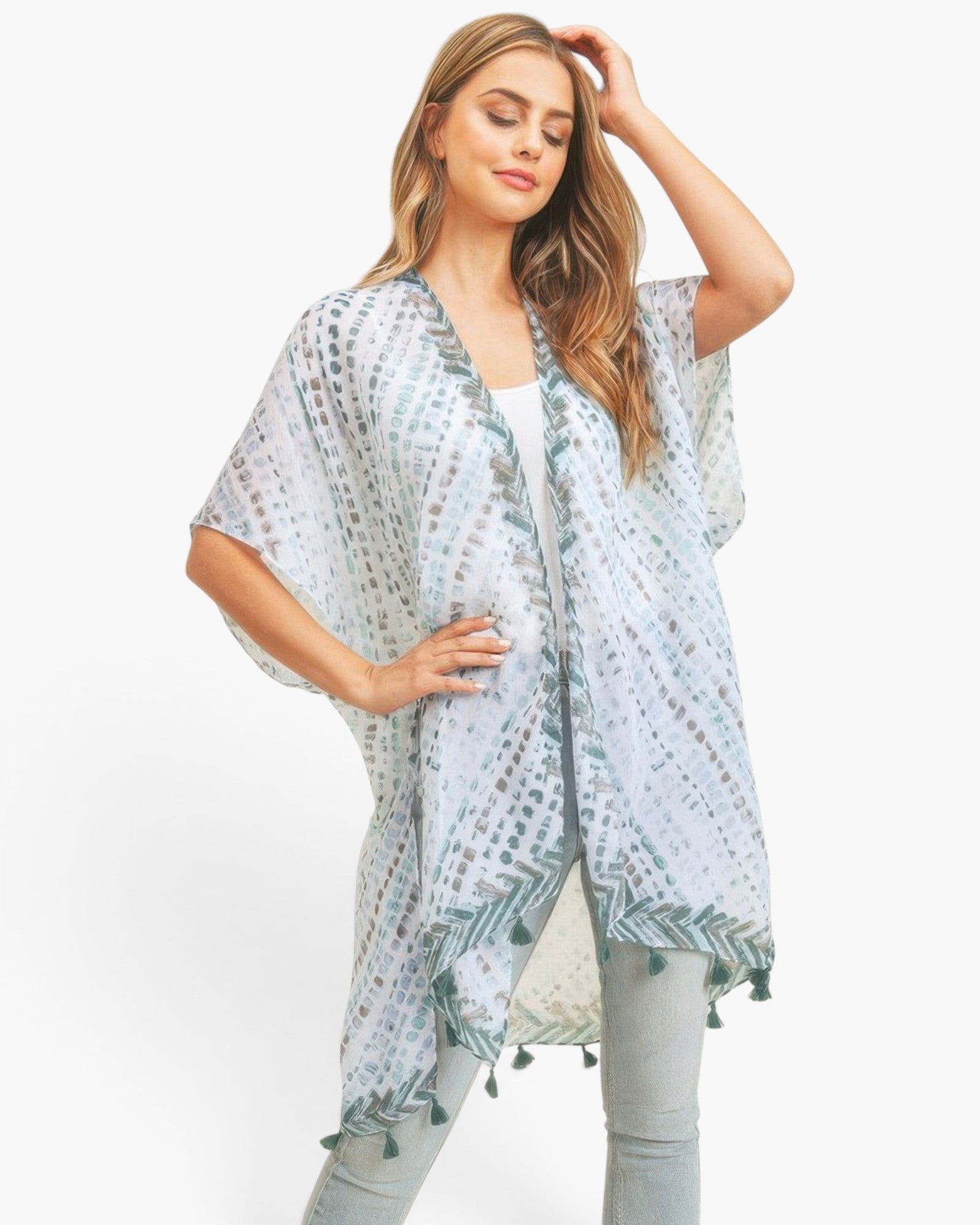 Beach Rose Co. multi dash pattern kimono with tassel trim and open-front design worn by a woman on a white background
