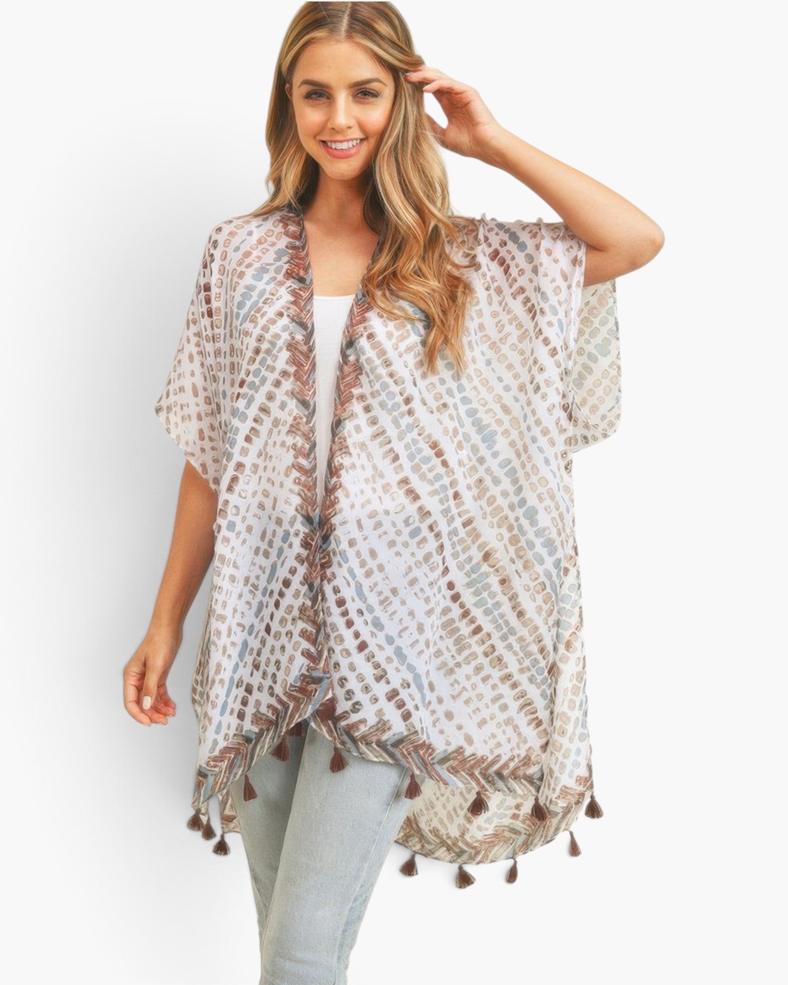 Beach Rose Co. multi dash pattern kimono with tassel trim, worn by a smiling woman in a light, flowy polyester fabric.