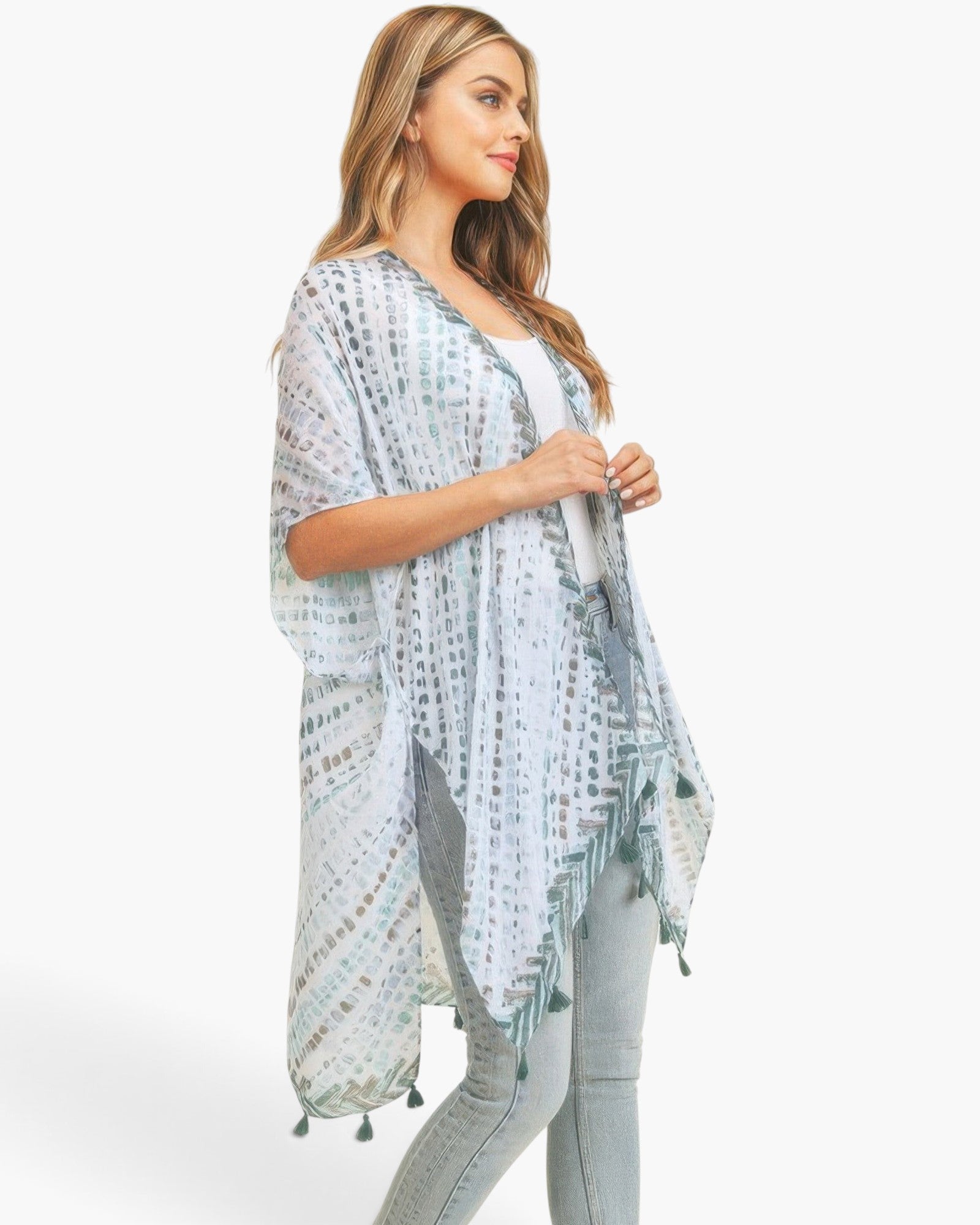 Beach Rose Co. multi dash pattern kimono with tassel trim worn by a model in a flowy, lightweight polyester fabric.