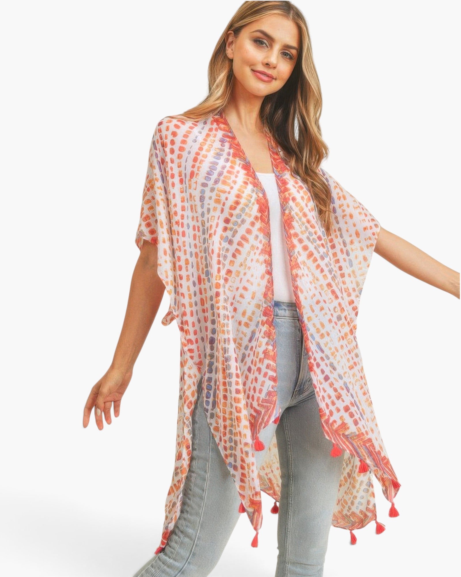 Beach Rose Co. multi dash pattern kimono with tassel trim, worn by a blonde model over a white top and jeans.