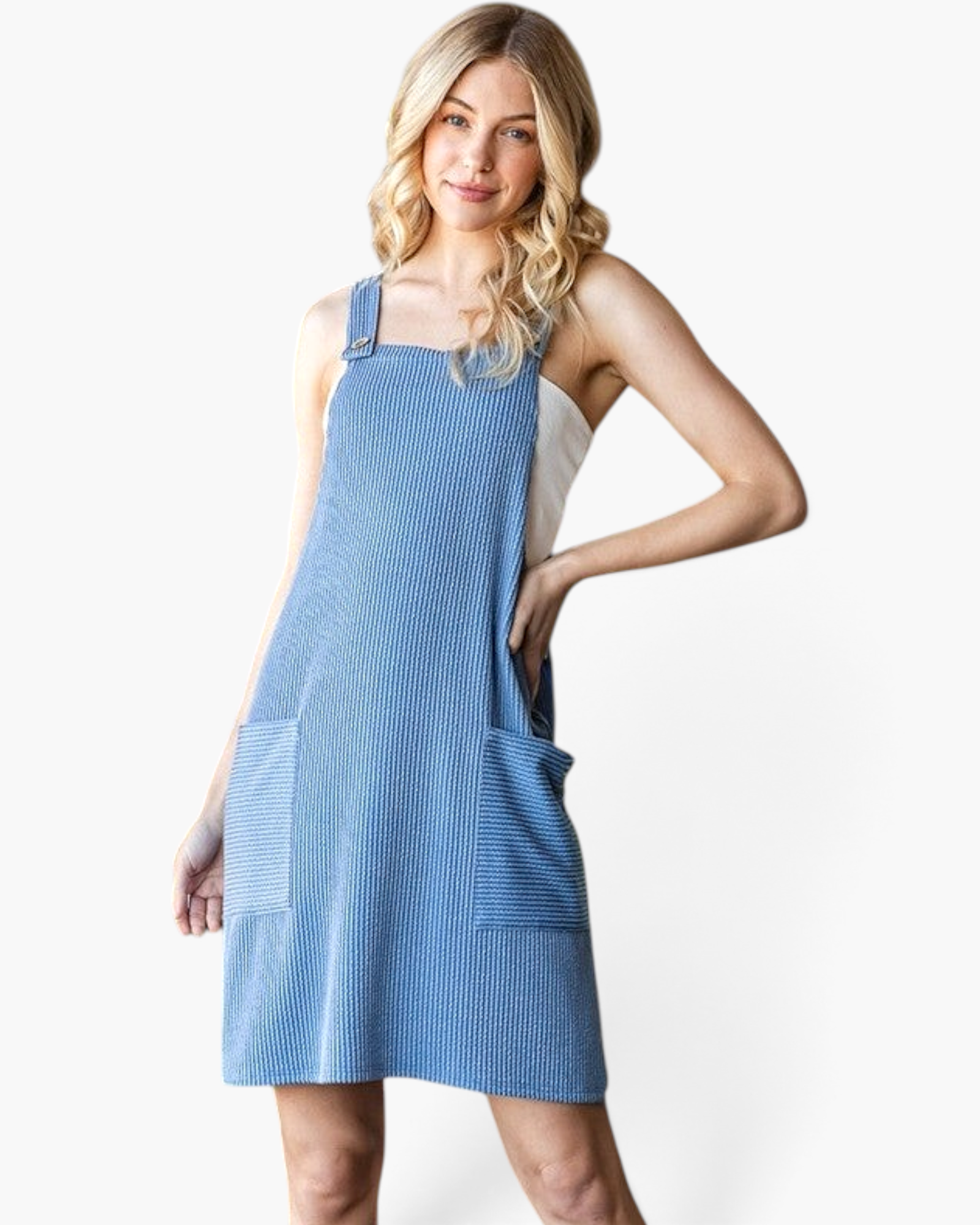 Beach Rose Co. denim blue ribbed overall dress with wide straps and patch pockets worn by a blonde model.