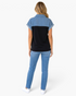 Beach Rose Co. Madisson short sleeve color block polo top with denim and black panels, back view on a model.