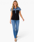Beach Rose Co. Madisson short sleeve polo top with denim patchwork and black color block design on a smiling model.