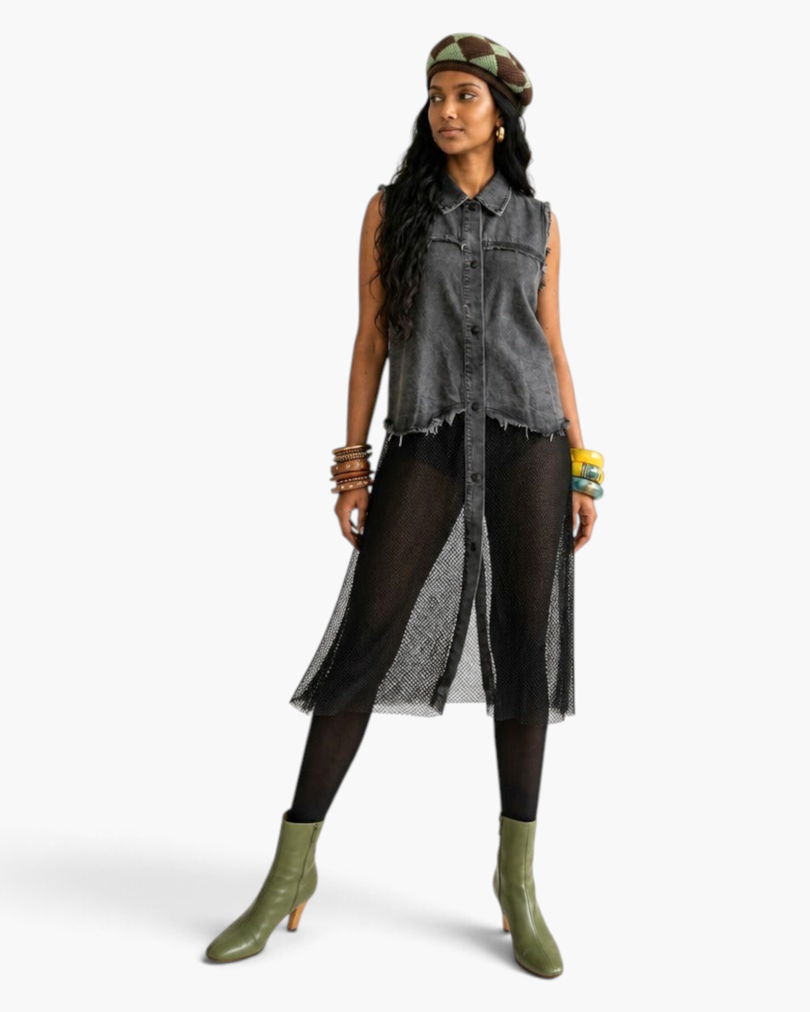 Model wearing a Beach Rose Co. sleeveless grey denim shirt dress with a sheer black mesh skirt and raw-edge details.