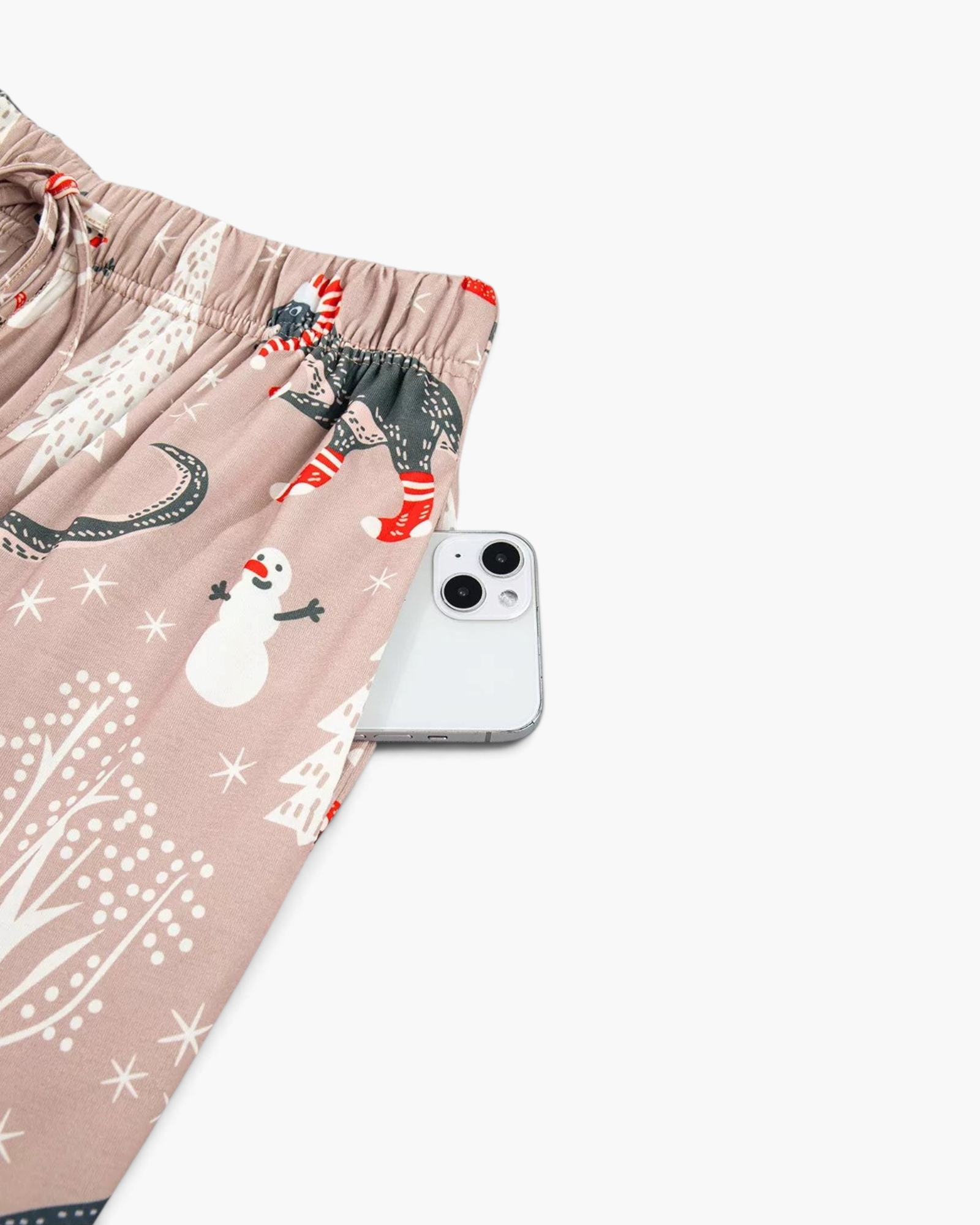 Beach Rose Co. taupe pajama pants with festive dinosaur, snowman, and tree print, featuring an elastic waistband.