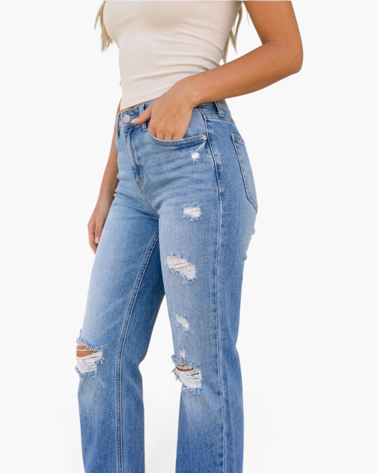 Beach Rose Co. medium wash mid-rise straight leg jeans with distressed frayed rips on a model