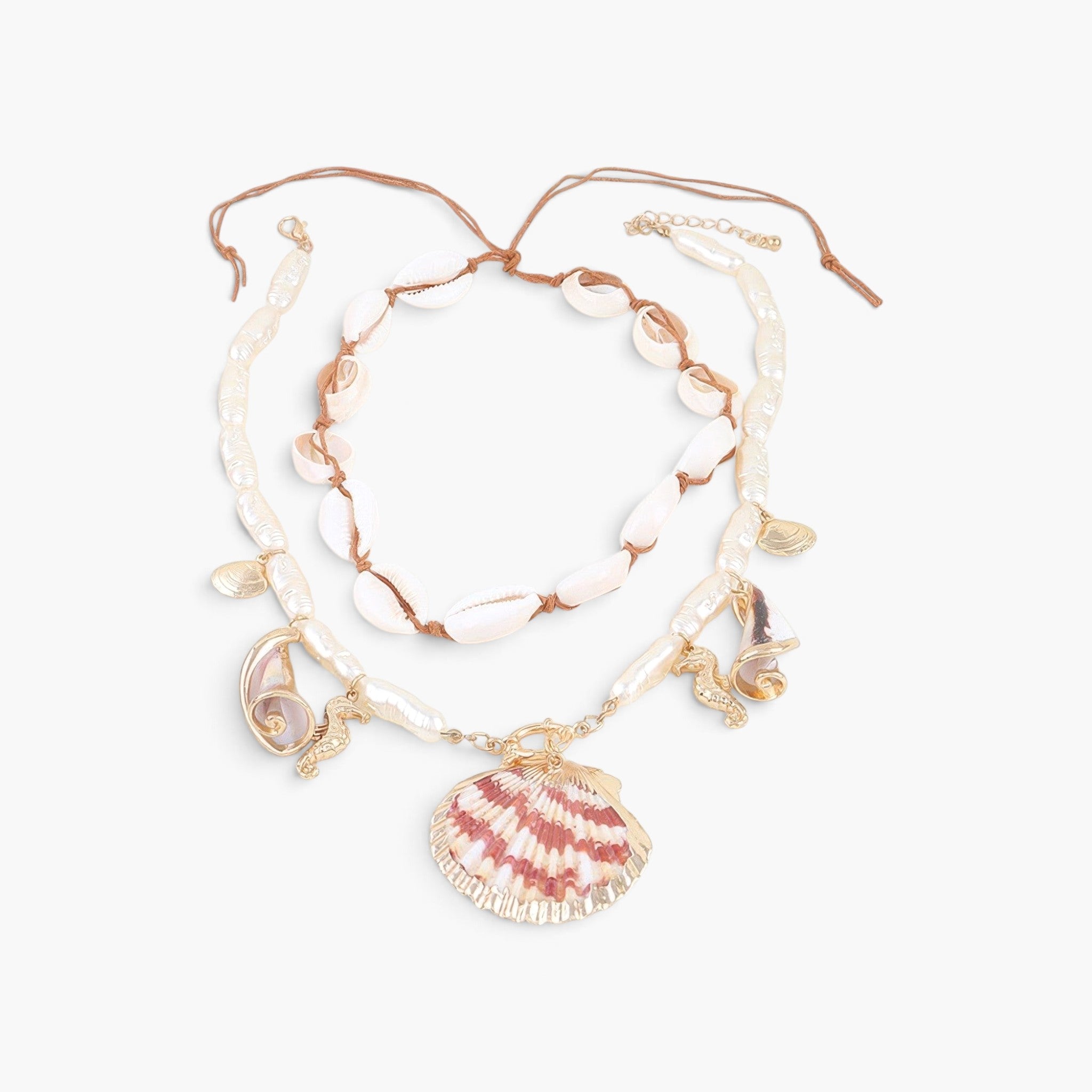 Beach Rose Co. double-layer necklace featuring cowrie shells, pearl-like beads, and gold nautical charms with a scallop shell.