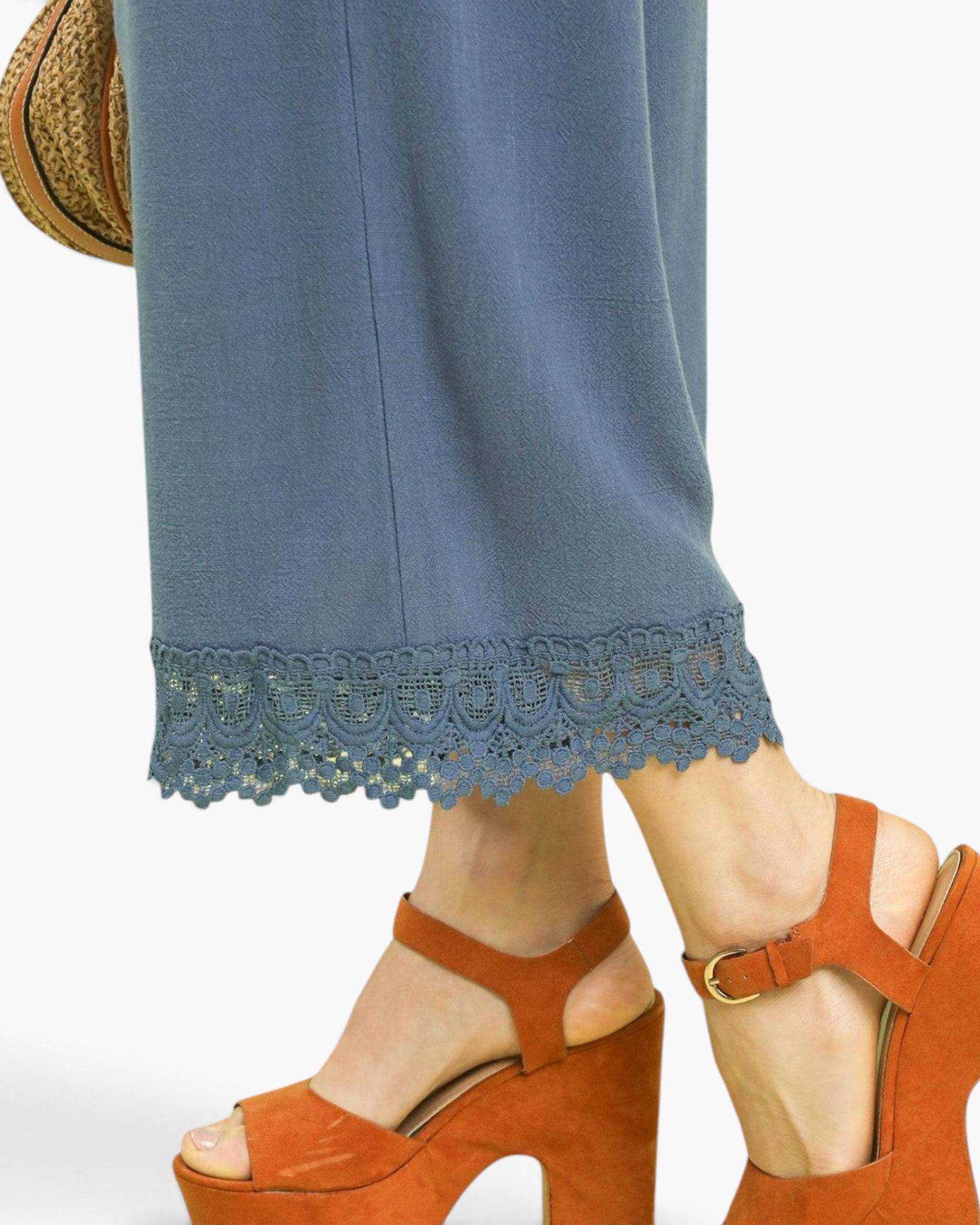 Beach Rose Co. dusty blue linen blend cropped pants featuring a scalloped lace hem, worn with brown platform sandals.