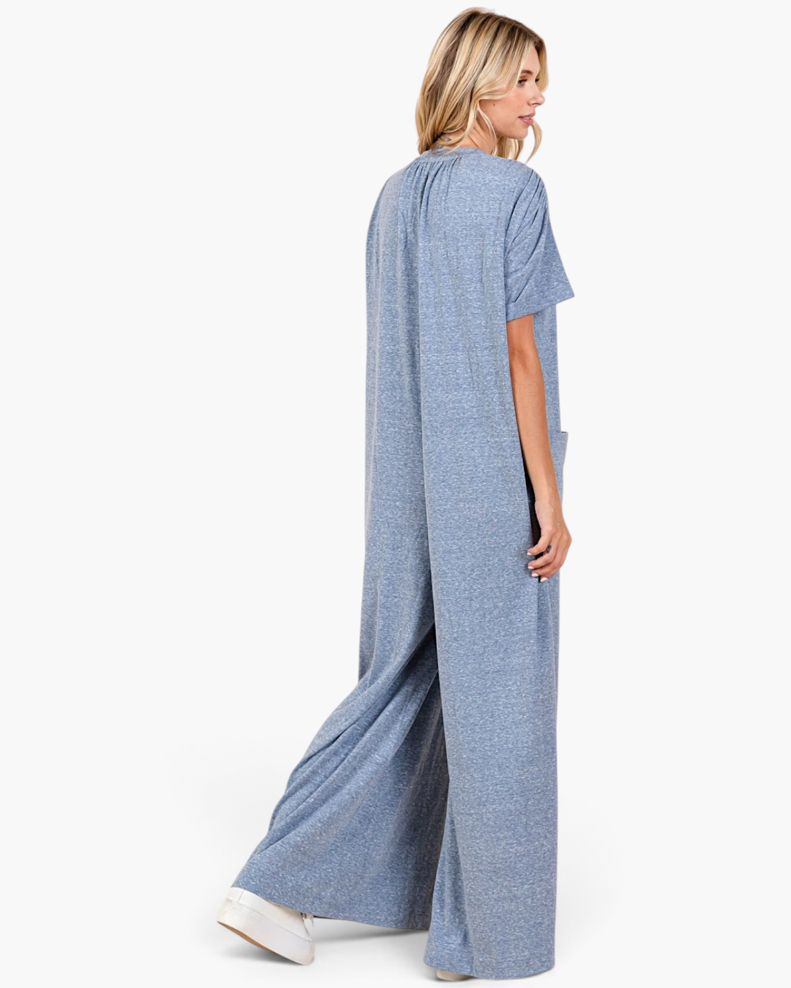 Beach Rose Co. dusty blue wide-leg jumpsuit with short sleeves and gathered shoulders, shown from the side.