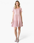 Beach Rose Co. dusty rose babydoll dress with ivory pom-pom trim, tiered skirt, and short sleeves on a model.