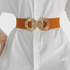 Beach Rose Co. wide elastic waist belt in rust orange with a gold-tone double circle alloy buckle over a white shirt.
