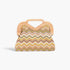 Beach Rose Co. faux straw clutch with a chevron pattern in earth tones and a light wood frame handle