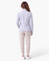 Beach Rose Co. light grey fitted polyester zip-up jacket with contoured seams and stand collar, back view.
