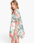 Beach Rose Co. ruffle-lined open-front cover-up featuring a vibrant tropical flamingo and foliage print on polyester.