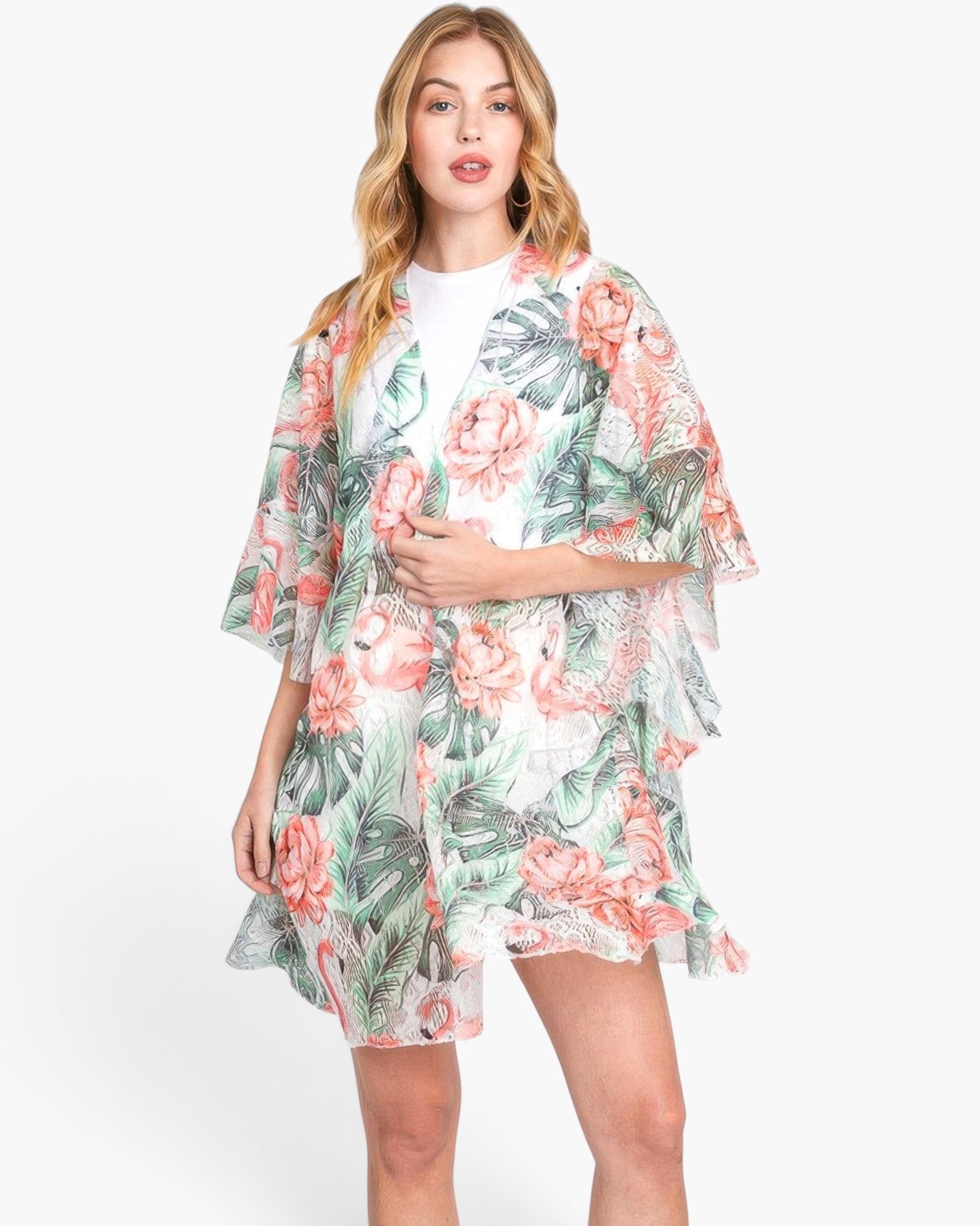 Beach Rose Co. model wearing a lightweight tropical flamingo and foliage print open-front cover-up with ruffle trim.
