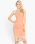 Beach Rose Co. flamingo pink ribbed halter neck midi dress with a decorative fringe hem worn by a blonde model