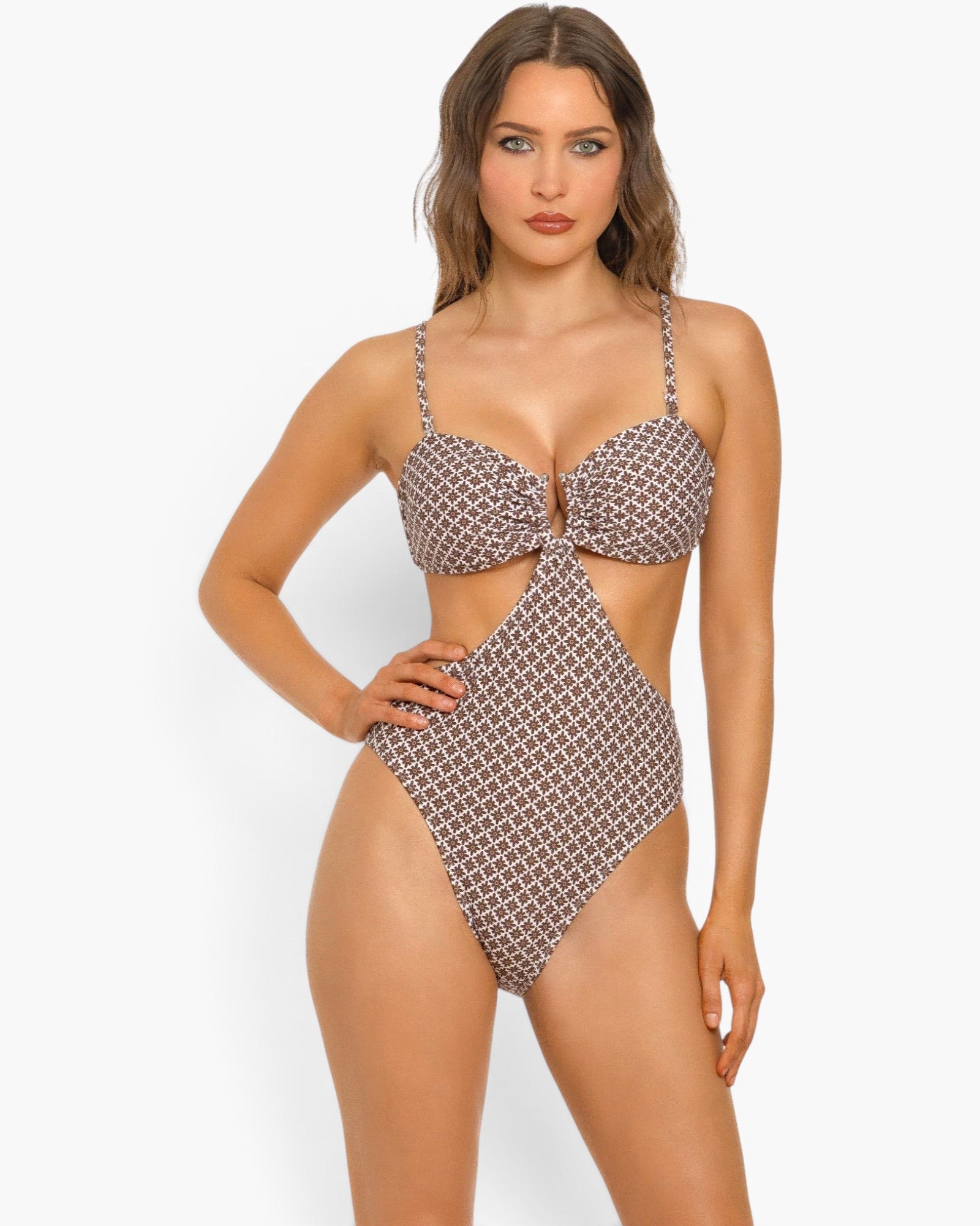 Beach Rose Co. Flora monokini swimsuit with a brown geometric print, U-ring front, and side cutouts on a model.