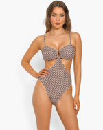 Beach Rose Co. Flora monokini swimsuit with a brown geometric print, U-ring front, and side cutouts on a model.